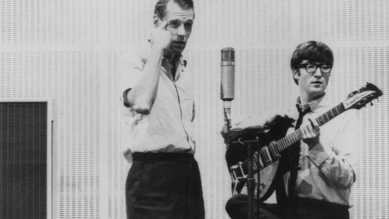 John Lennon is seen with Sir George Martin, often dubbed the fifth Beatle, the legendary Beatles producer, who first signed the Beatles to his Parlophone label when they were unknown. He then oversaw their rise to fame and who wrote or performed many of the orchestral arrangements in their songs.