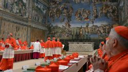 This handout picture released by the Press office shows cardinals queuing in the Sistine Chapel to swear on the Bible to never reveal the secrets of their deliberations before the start of the conclave at the Vatican on March 12, 2013. Cardinals moved into the Vatican today as the suspense mounted ahead of a secret papal election with no clear frontrunner to steer the Catholic world through troubled waters after Benedict XVI's historic resignation. The 115 cardinal electors who pick the next leader of 1.2 billion Catholics in a conclave in the Sistine Chapel will live inside the Vatican walls completely cut off from the outside world until they have made their choice. AFP PHOTO/OSSERVATORE ROMANO RESTRICTED TO EDITORIAL USE - MANDATORY CREDIT "AFP PHOTO/OSSERVATORE ROMANO' (Photo credit should read -/AFP/Getty Images) 