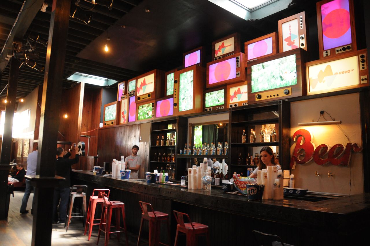 Screens light up the bar at the VEVO TV Launch on March 12.