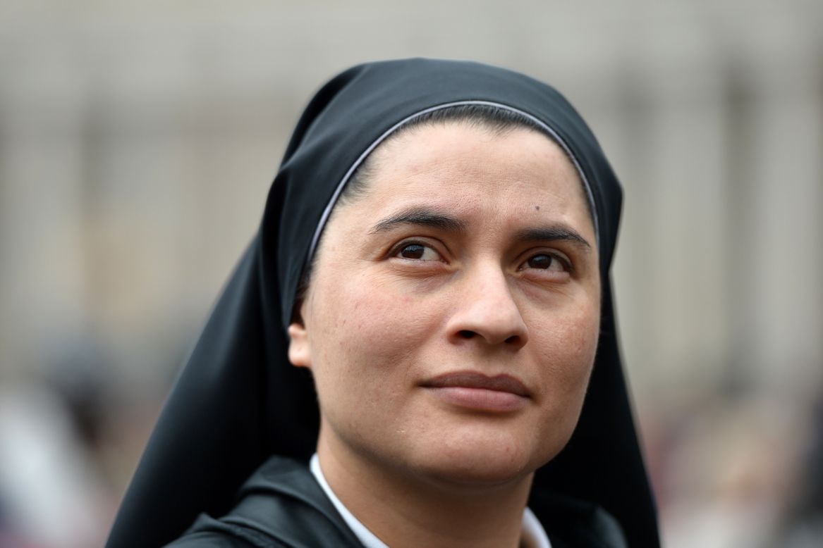A nun waits for the results at the Vatican on March 13. 