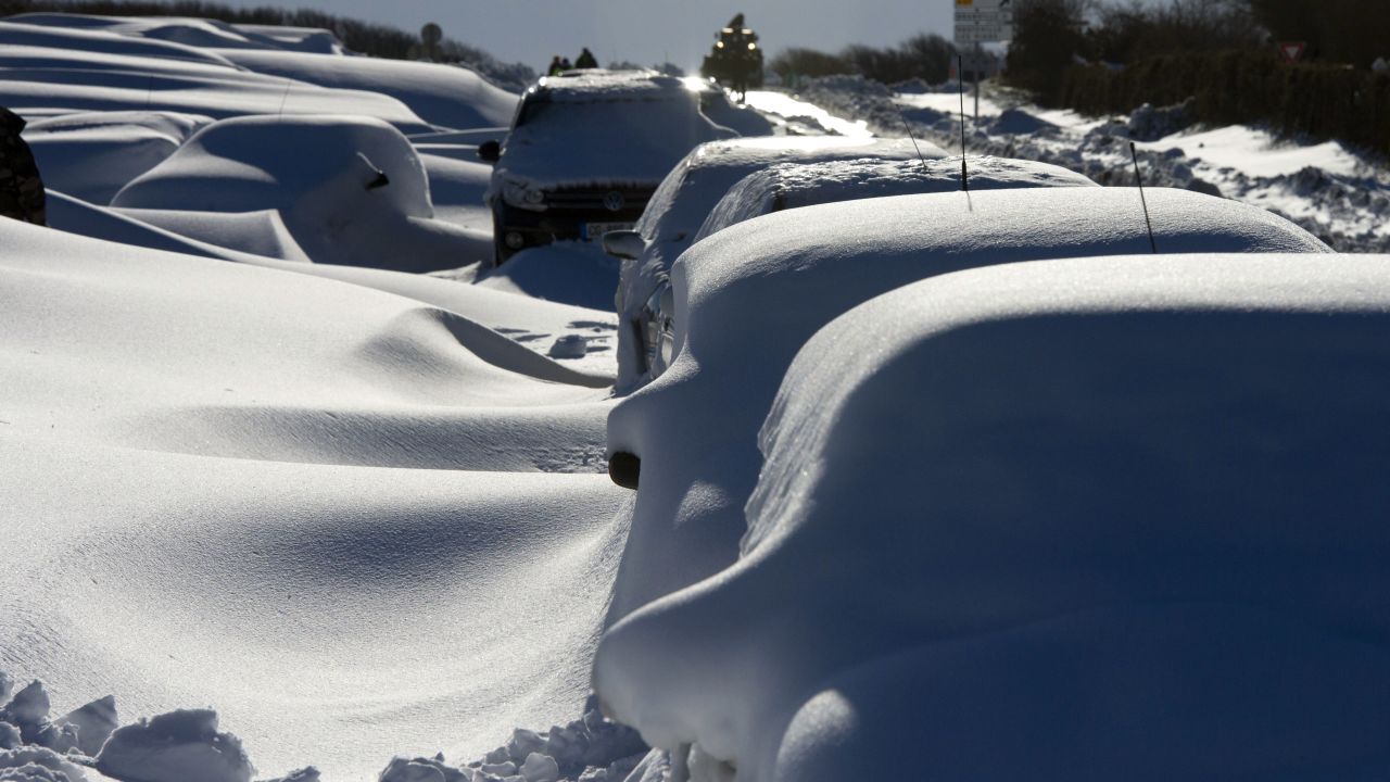 Cars covered in snow in northern France on Wednesday following a heavy snowstorm.