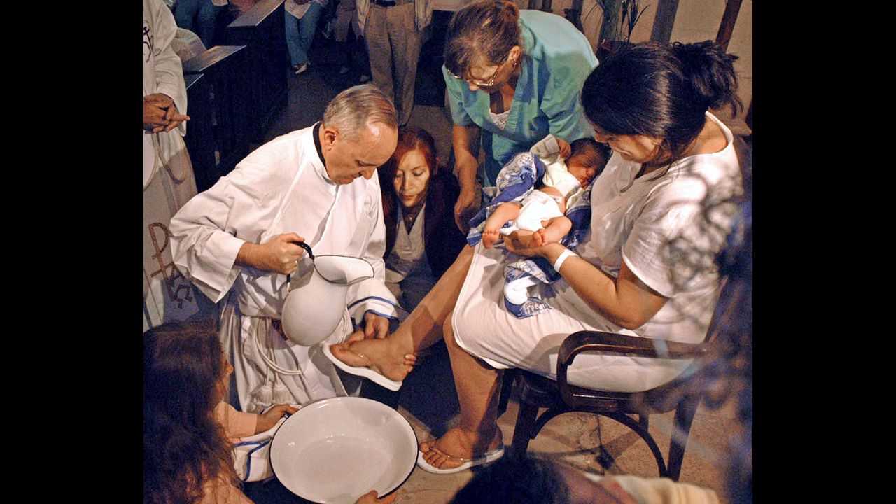 Bergoglio is shown washing the feet of a woman on Holy Thursday at the Sarda maternity hospital in Buenos Aires in 2005.