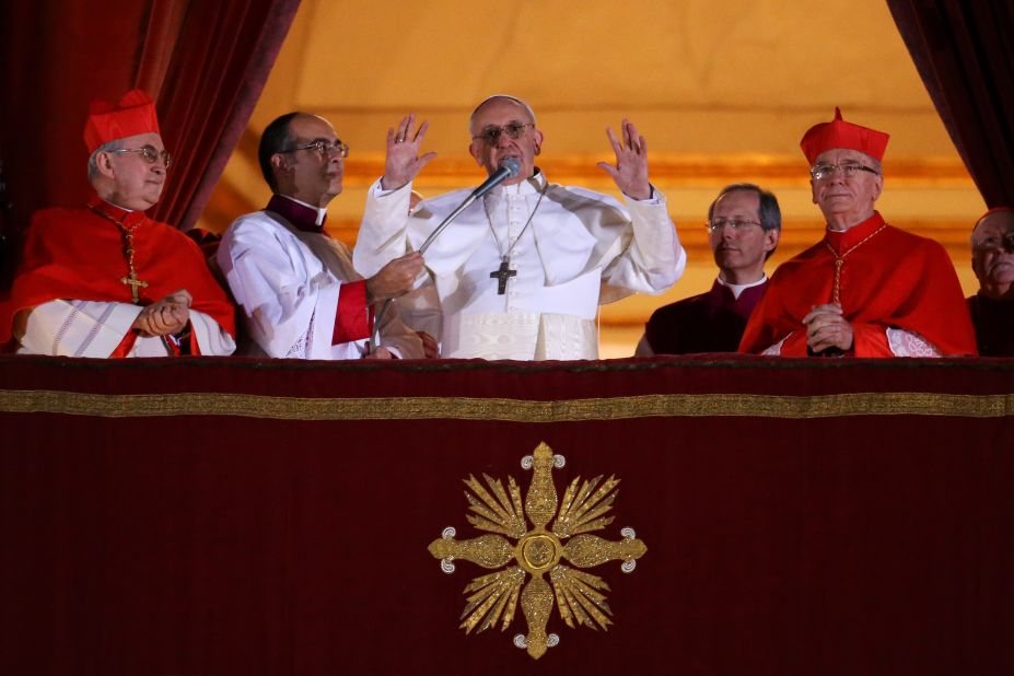 Newly elected Pope Francis speaks to the crowd from the central balcony of St. Peter's Basilica at the Vatican on Wednesday, March 13. Argentinian Cardinal Jorge Mario Bergoglio was elected as the first pontiff from Latin America and will lead the world's 1.2 billion Catholics.