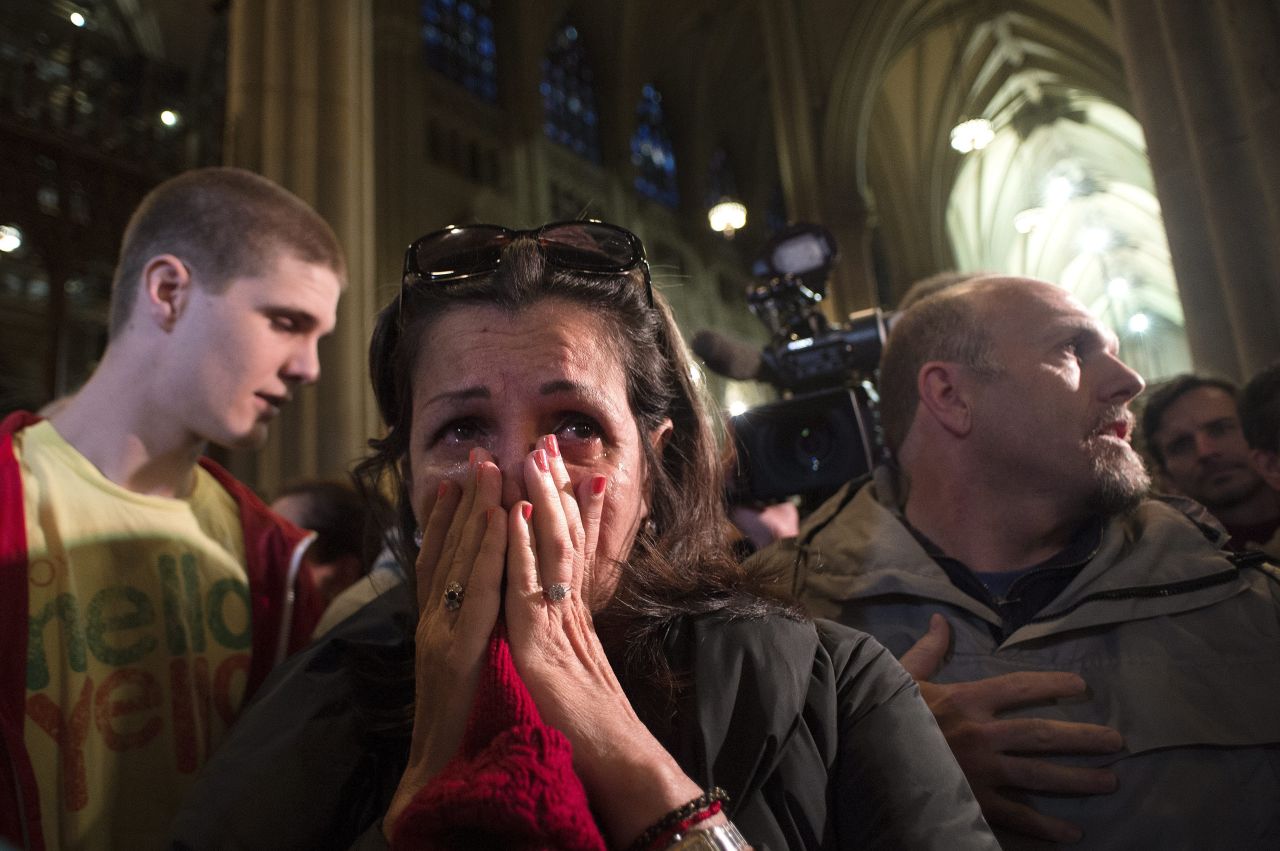 Shelly Guadelupe of Puerto Rico cries at St. Patrick's Cathedral in New York.