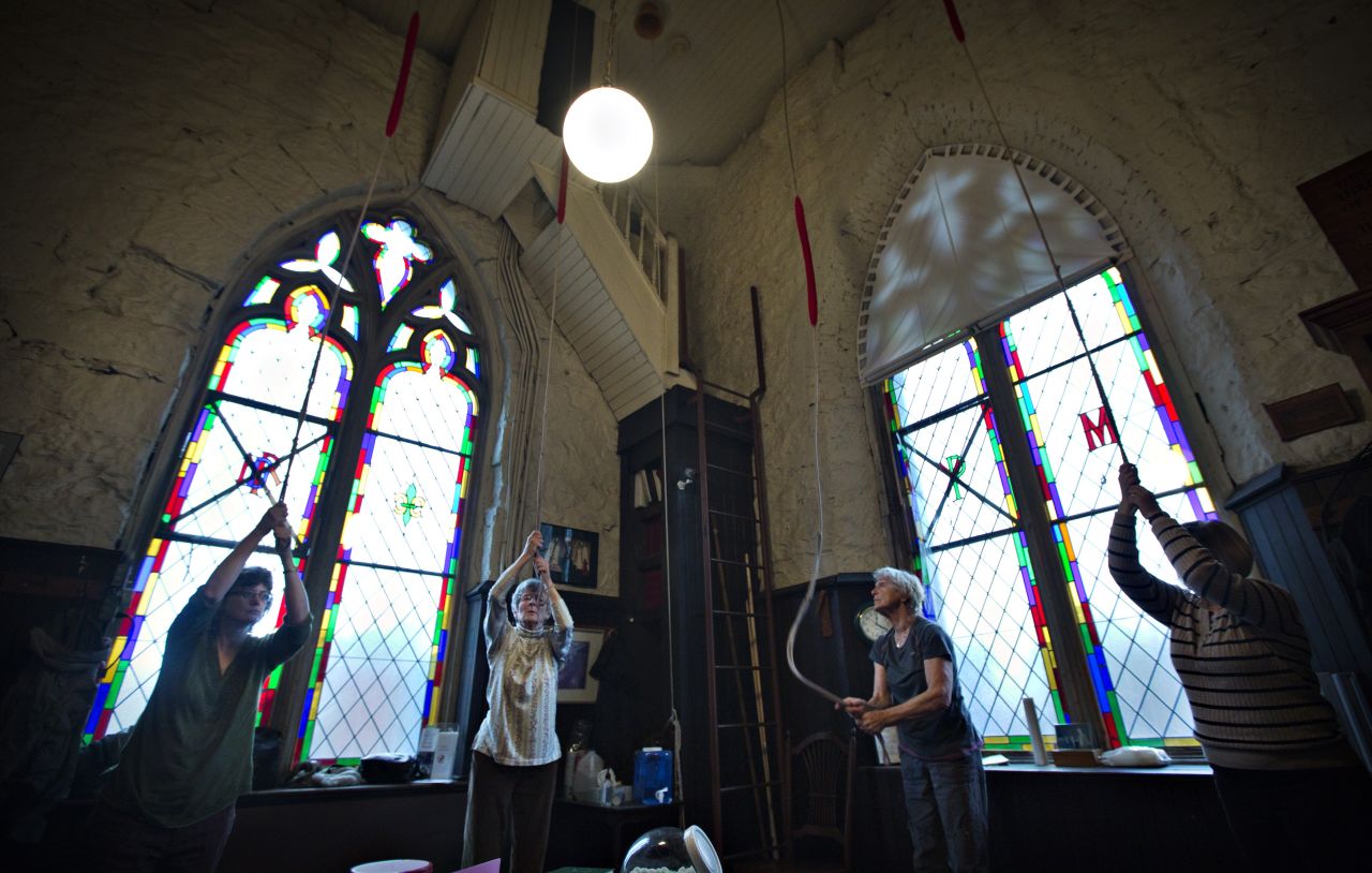 Parishioners ring the 100-year-old bells in the tower of Holy Rosary Cathedral in Vancouver in honor of the new pope.