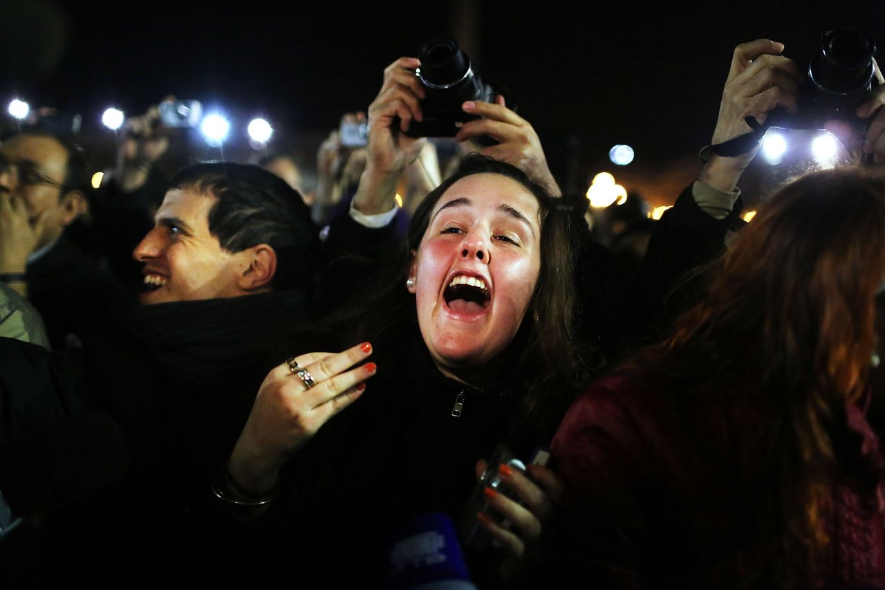 A woman screams as she listens to the announcement that the new pope will be Cardinal Jorge Mario Bergoglio of Argentina.