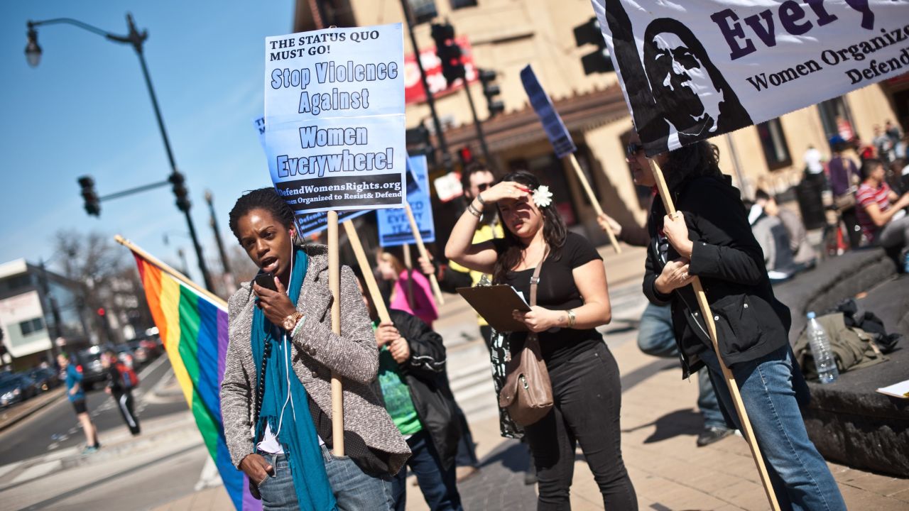 Protesters note the issue of domestic violence doesn't apply only to heterosexuals.
