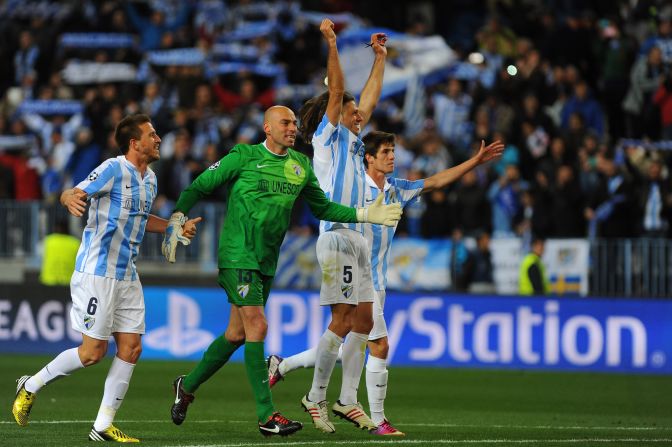 Malaga's players celebrate at the final whistle following the 2-0 win over Porto -- a result which secured a 2-1 aggregate victory overall and its place in the quarterfinals for the first time in its history.