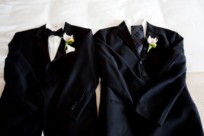 A wedding without a gown provides the chance to give two suits the royal treatment. In other words, avoid the temptation to go matchy-matchy and use accessories like ties, bow ties and cuff links to distinguish one from the other.
