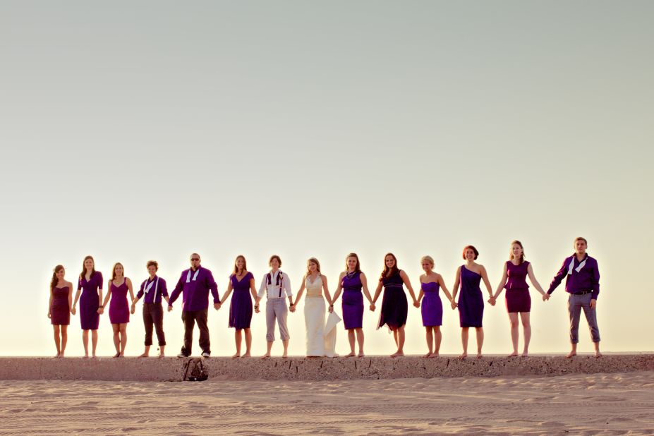 Group shots can be overly posed or dryly composed, but they don't have to be. The image chosen for the book's cover "offers the simplicity of the horizon and the steadfast strength of community," Hamm says. From the mix of attire styles and colors, this gender-blended wedding party shows unwavering unity amid the embrace of individuality.