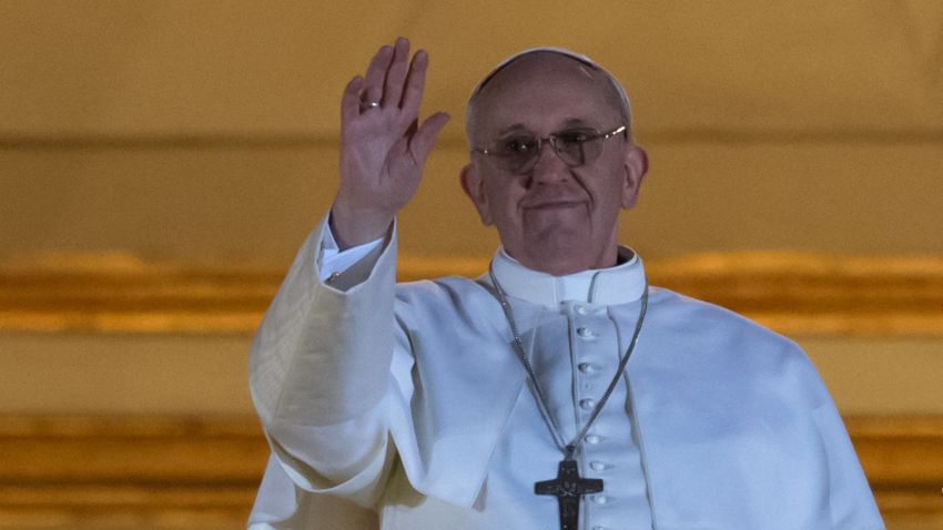 Argentina's Jorge Bergoglio, elected Pope Francis I waves from the window of St Peter's Basilica's balcony after being elected the 266th pope of the Roman Catholic Church on March 13, 2013 at the Vatican. 