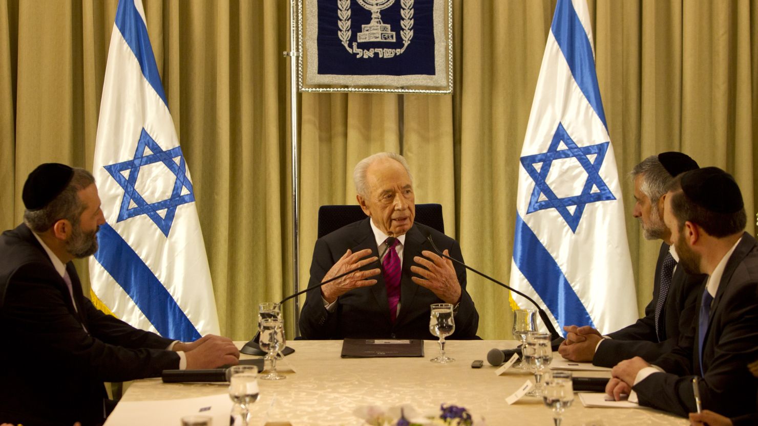 President Shimon Peres (C) sits with Shas Party leaders at the President's residence on  January 31, 2013, Jerusalem.