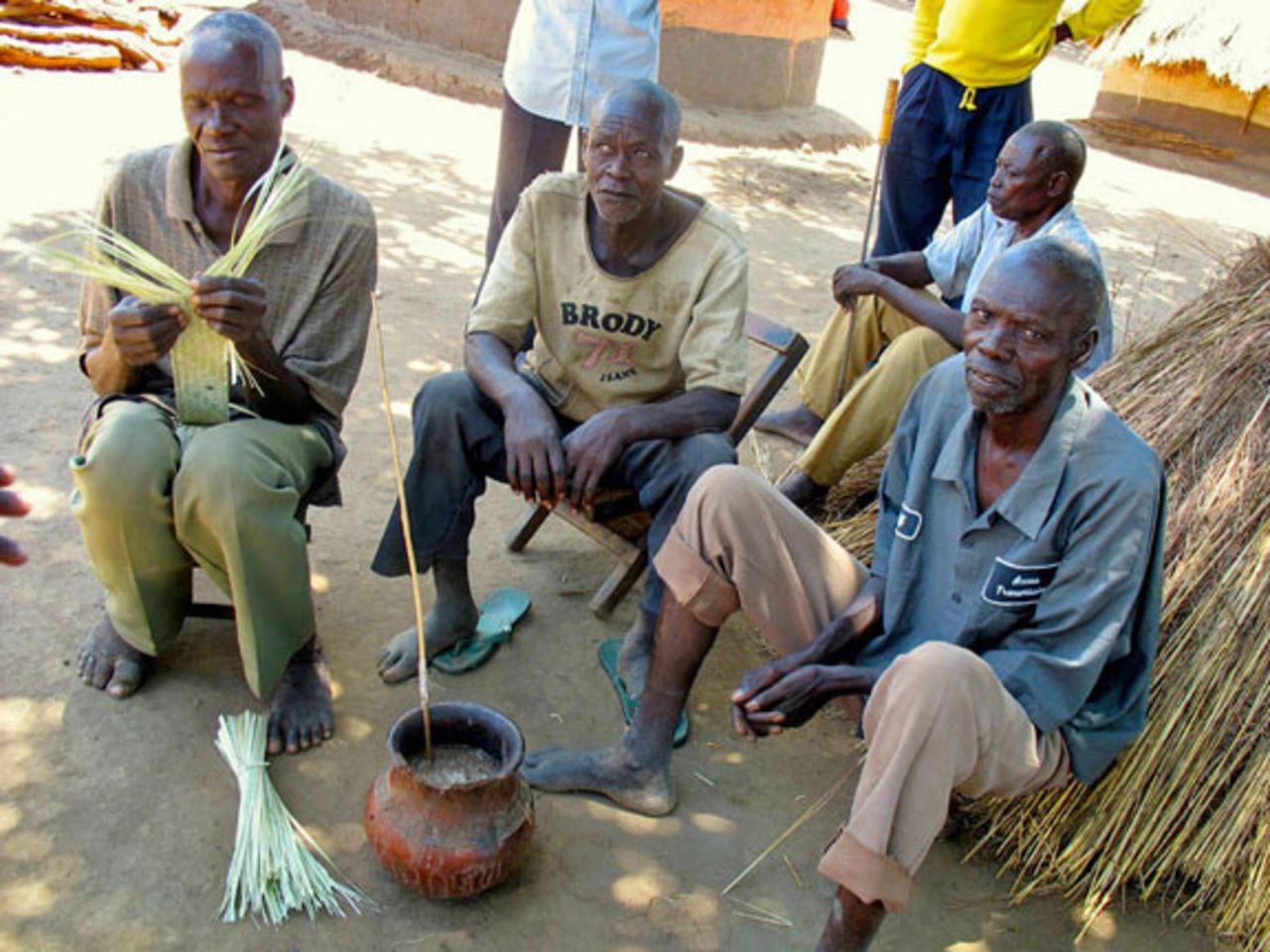 Statistically Africa's biggest drinkers, Ugandans enjoy a pot of ajono, a semi-fermented beer. "Getting a round in" here just involves passing the straw. 