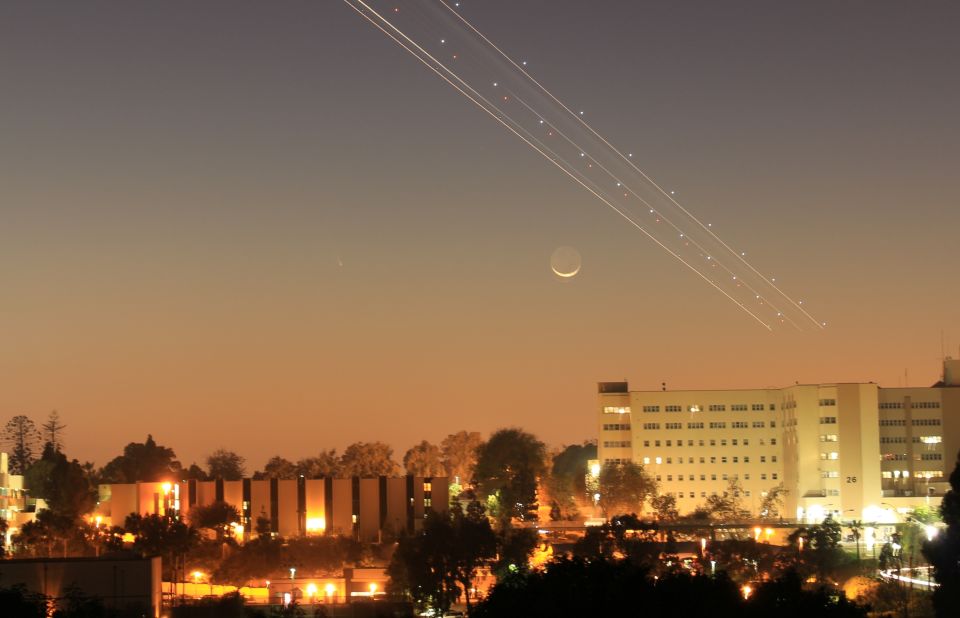 Larry Flynn and his partner were able to see the moon and a passing jet from downtown San Diego, but were not able to see the comet. They were surprised to see it faintly appear in the photo when they returned home.