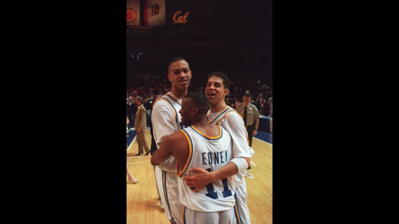 From left, UCLA players J.R. Henderson, Tyus Edney and Toby Bailey  celebrate after beating UConn 102-96 in the NCAA West Regional final in Oakland, California, on March 25, 1995. UCLA went on to take the title by defeating Arkansas 89-78.