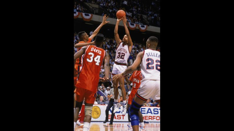 Tate George of the UConn Huskies sinks the game-winning shot at the buzzer to beat Clemson 71-70 on March 22, 1990, in East Rutherford, New Jersey, moving them to the Elite Eight for the first time since 1964.