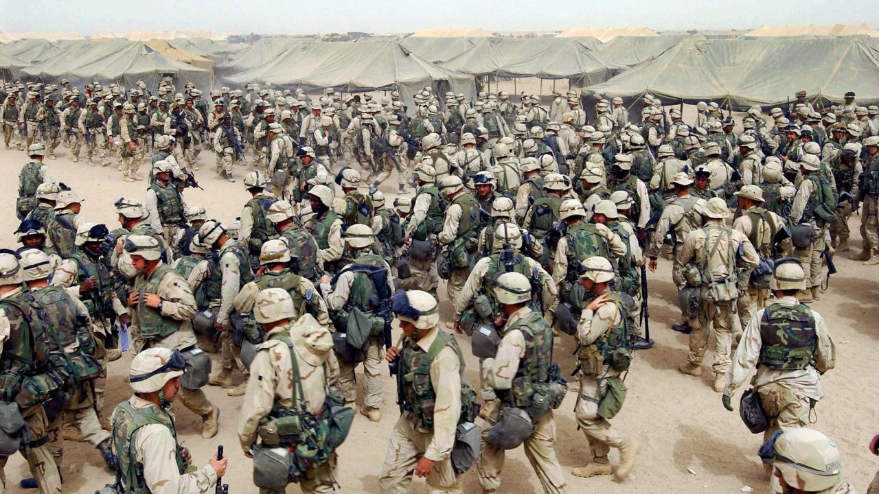 U.S. Marines in northern Kuwait gear up after receiving orders to cross the Iraqi border on March 20, 2003. It has been more than 10 years since the American-led invasion of Iraq that toppled the regime of Saddam Hussein. Look back at 100 moments from the war and the legacy it left behind.