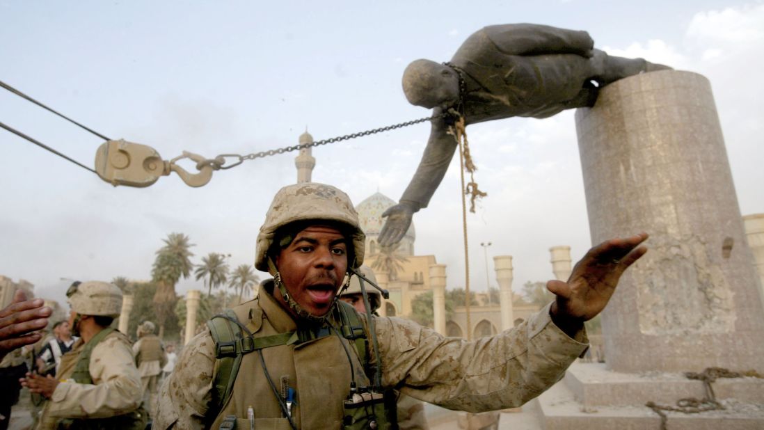 Marines pull down a statue of Saddam Hussein, a symbolic finale to the fall of Baghdad, on April 9, 2003.