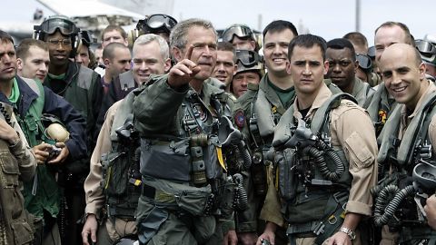 Dressed in a flight suit, President Bush meets pilots and crew members of the aircraft carrier USS Abraham Lincoln who were returning to the United States on May 1, 2003, after being deployed in the Gulf region.