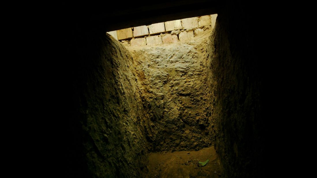 The entrance to the "spider hole" where Saddam Hussein was hiding in Ad Dawr is seen from the inside on December 15, 2003.