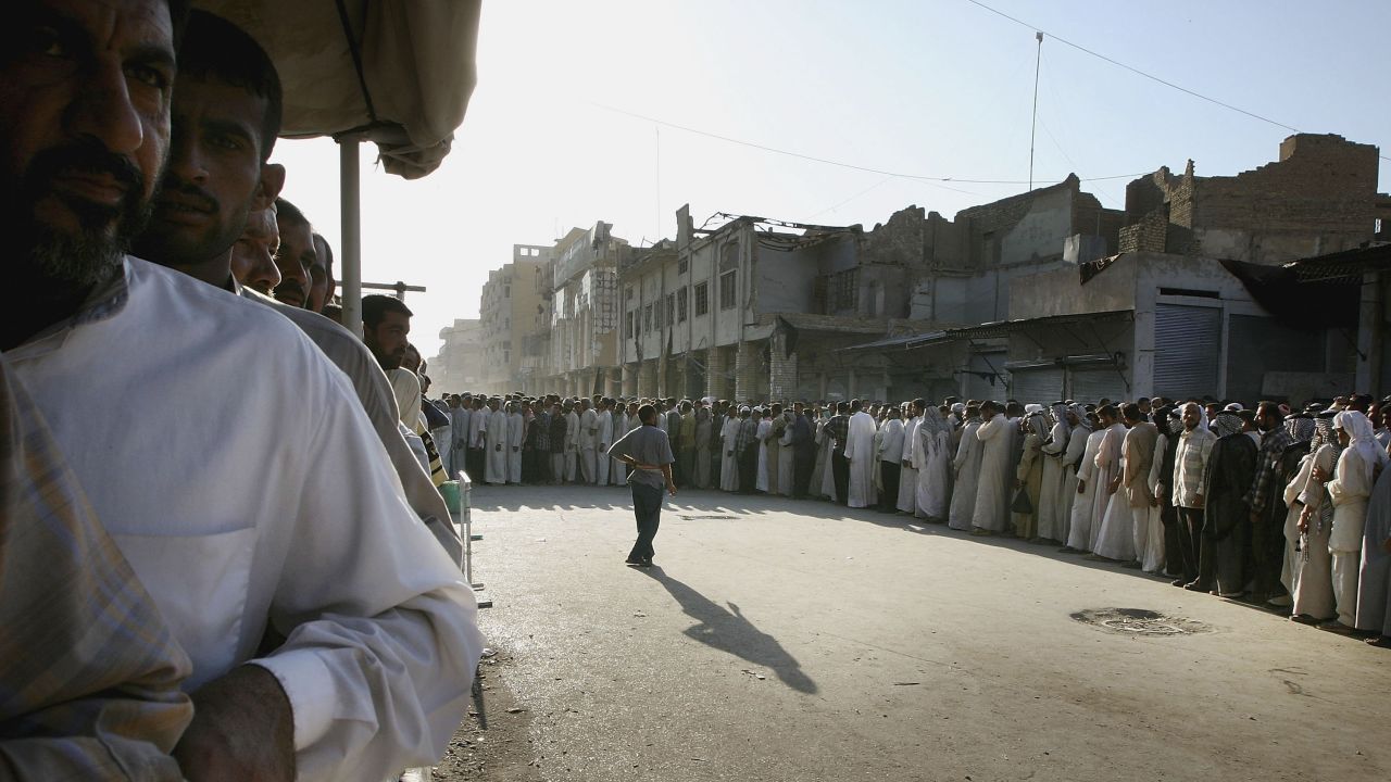 Iraqi Shiite faithful gather in Najaf on August 27, 2004, to mark the end of a battle. Rebel leader Muqtada al-Sadr ordered his fighters to lay down their arms in a peace deal brokered by Iraq's most revered Shiite cleric, Grand Ayatollah Ali al-Sistani.