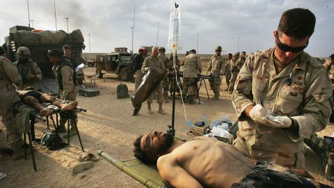 U.S. Army medics treat a wounded Jordanian fighter in Fallujah on November 14, 2004.