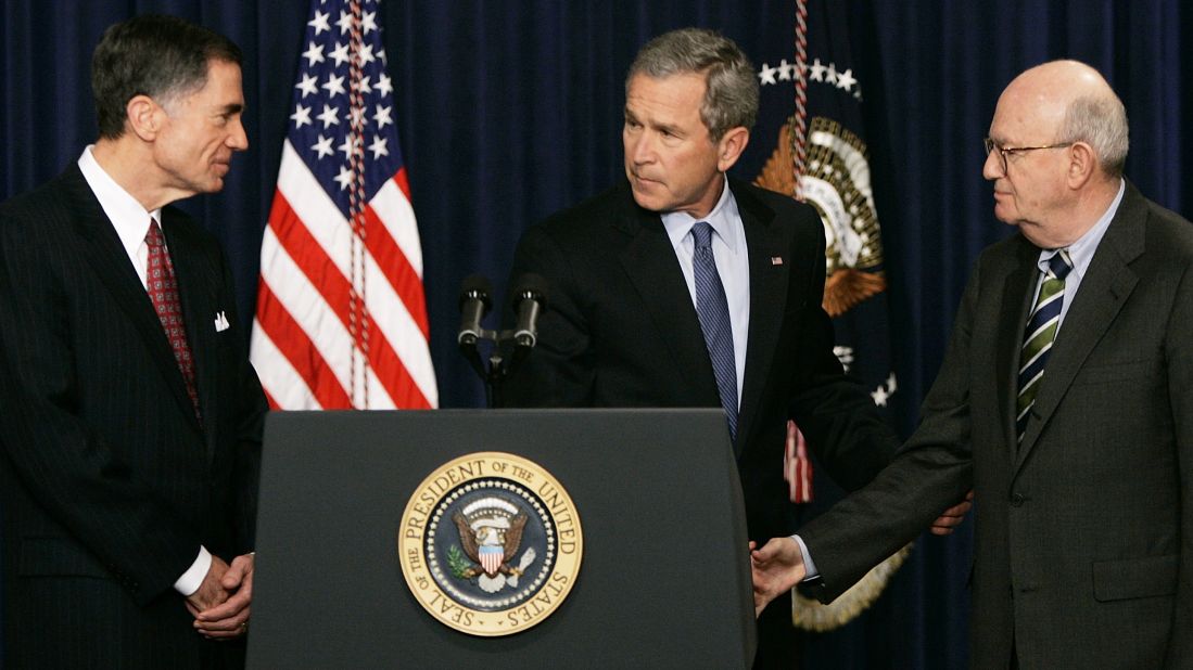President Bush shakes hands with former Sen. Charles Robb, left, and Judge Laurence Silberman during a news conference in Washington on March 31, 2005. The co-chairmen of the Iraqi Intelligence Commission issued a report indicating that U.S. intelligence agencies were wrong in most pre-war assessments about weapons of mass destruction in Iraq.