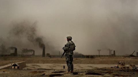 A U.S. soldier with 2nd Brigade, 1st Armored Division, stands on a kiln overlooking more than 150 brick factories in Narwan on July 1, 2008.