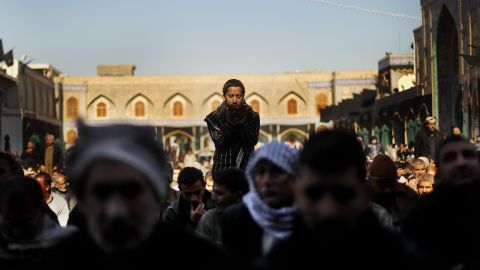 Shiite worshipers pray during an Ashura commemoration ceremony at the Kadhimiya shrine in Baghdad on December 6, 2011. Ashura marks the death of Prophet Mohammed's grandson, the revered Imam Hussein.