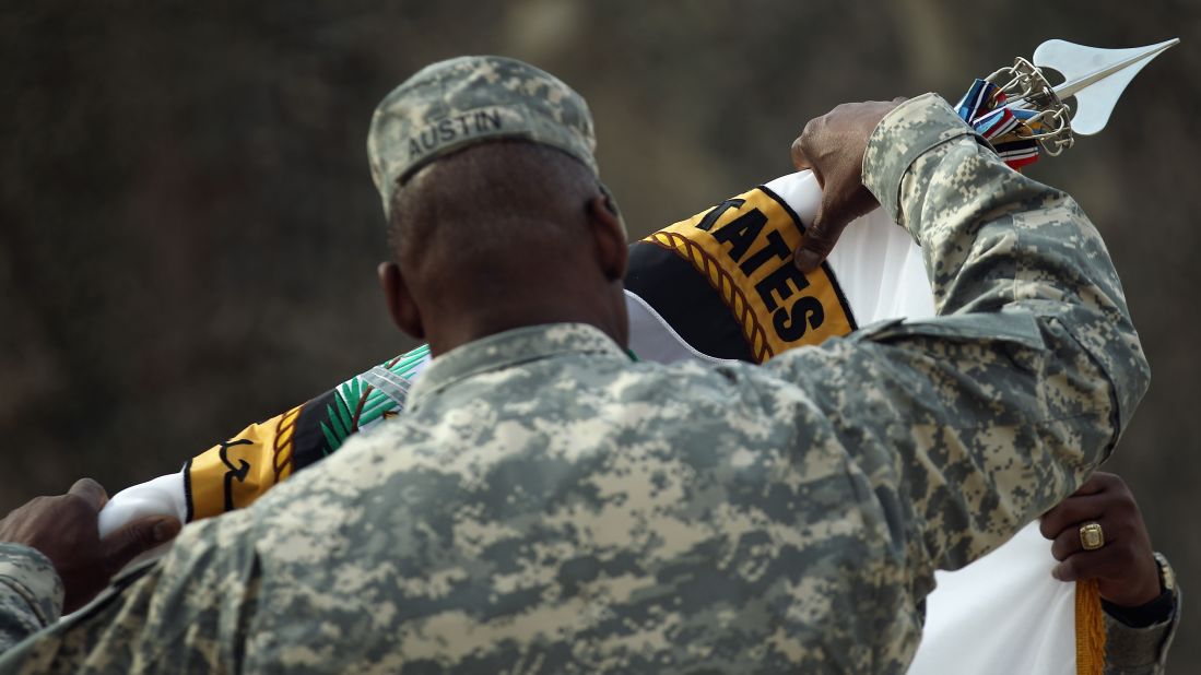 Gen. Lloyd Austin retires the United States Forces-Iraq flag during a casing ceremony at the former Sather Air Base in Baghdad on December 15, 2011.