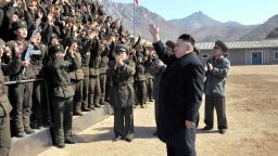 This undated picture released by North Korea's official Korean Central News Agency on March 12, 2013 shows North Korean leader Kim Jong Un (R) inspecting a long-range artillery sub-unit of Korean People's Army Unit 641 at undisclosed place in North Korea.