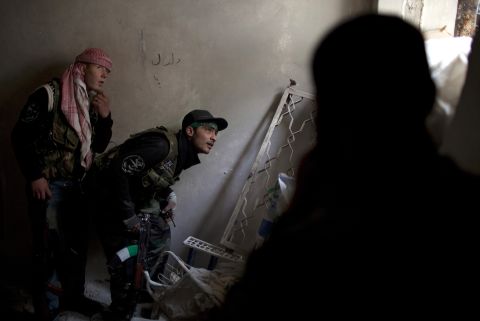 Syrian rebels take position in Aleppo, the largest city in the country, on March 11.