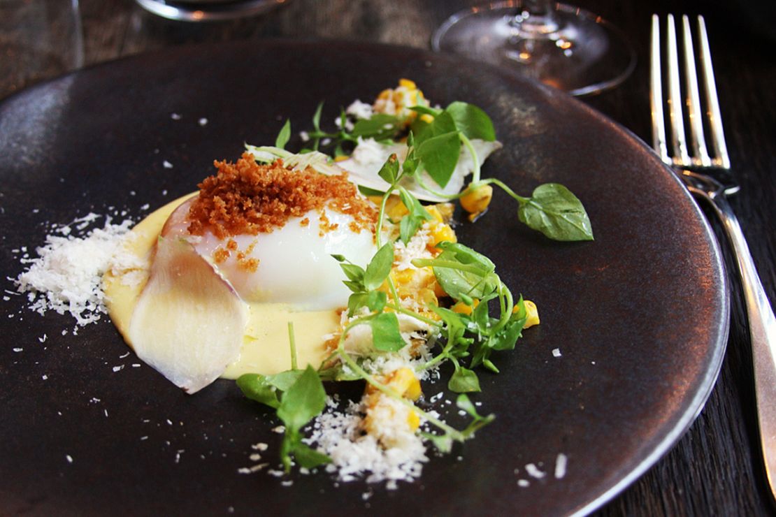 A perfectly poached egg with corn and parmesan at Septime. The no-choice menu changes seasonally.