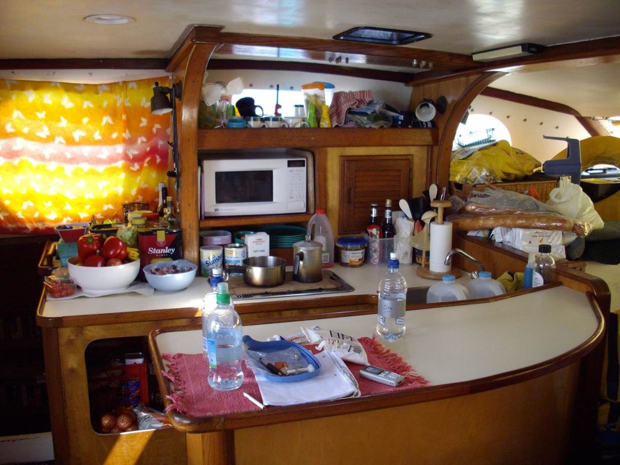 The crew prepared meals in the catamaran's intimate galley.
