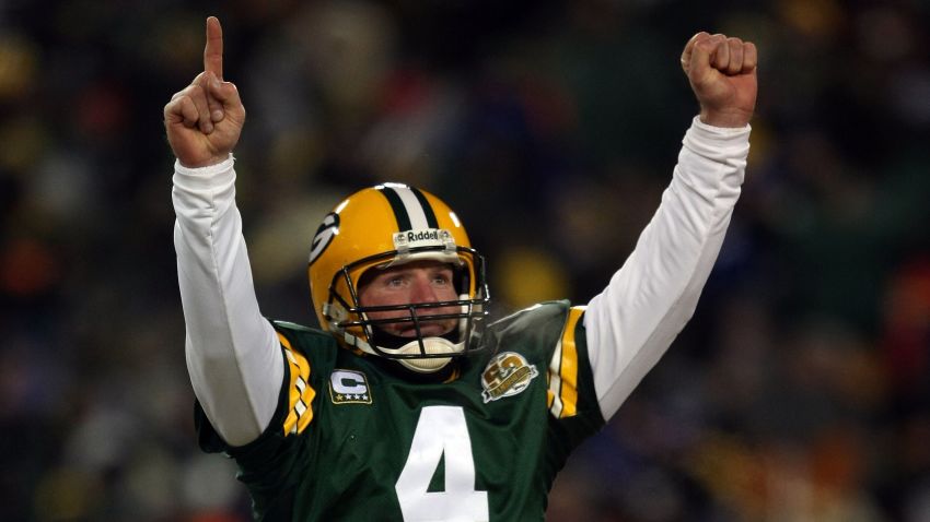 GREEN BAY, WI - JANUARY 20:  Quarterback Brett Favre #4 of the Green Bay Packers reacts after a Packers touchdown during the NFC championship game against the New York Giants on January 20, 2008 at Lambeau Field in Green Bay, Wisconsin. The Giants defeated the Packers 23-20 in overtime to advance to the Superbowl XLII.  (Photo by Jonathan Daniel/Getty Images)