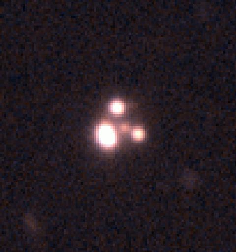 An image of a quasar is seen through a telescope. 