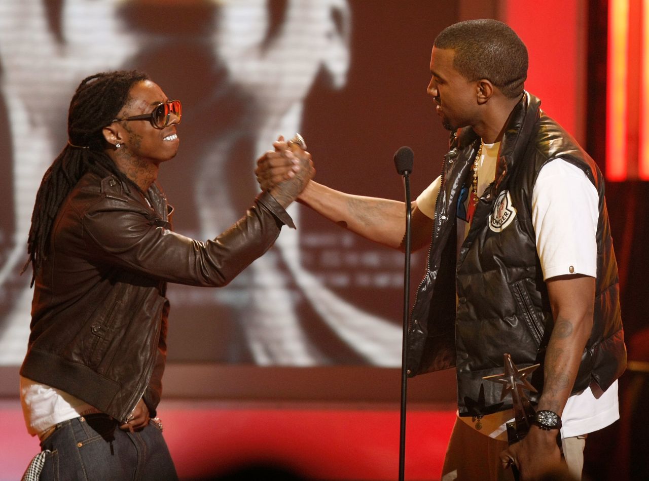 Rapper Lil Wayne, left, congratulates Kanye West on his Best Male Hip Hop Artist win onstage during the 2008 BET Awards at the Shrine Auditorium on June 24, 2008, in Los Angeles. 