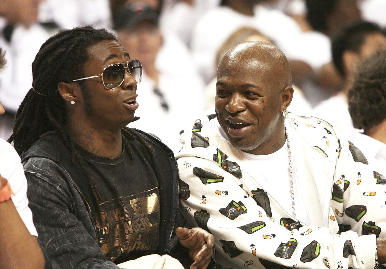 Lil Wayne and Baby AKA Birdman watch the New Jersey Nets play the Miami Heat during the NBA playoffs in 2006.