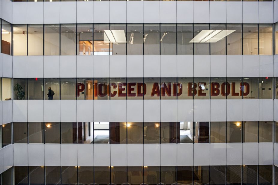 Message on the windows in the atrium of Facebook's New York City headquarters reads "Proceed and be bold." 
