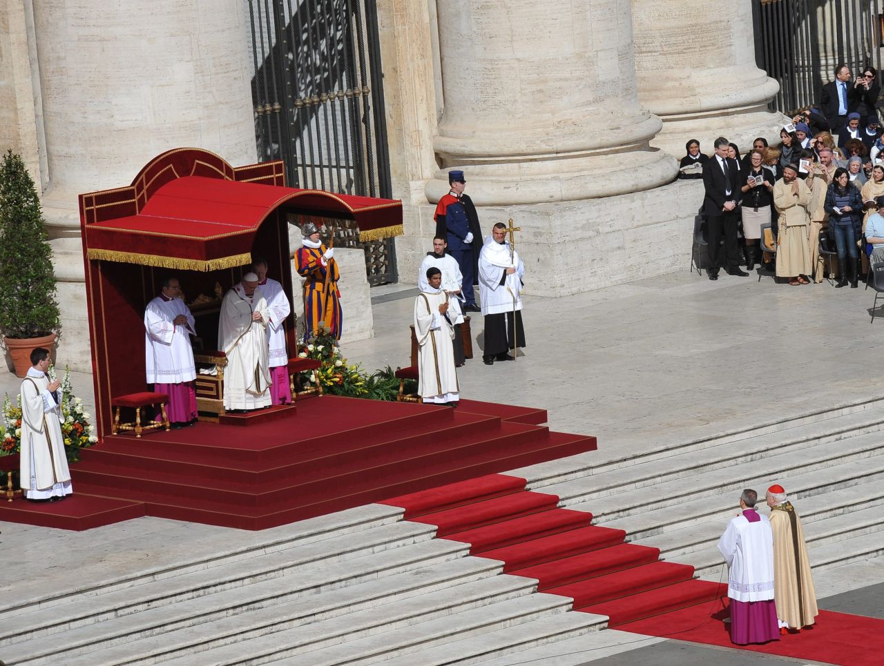 Francis prays during his inauguration Mass in St. Peter's Square on March 19.