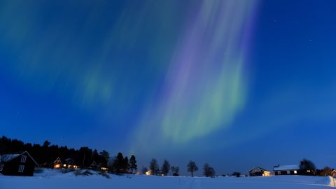 The aurora borealis lights up the sky at twilight on Sunday, March 17, between the towns of Are and Ostersund, Sweden.