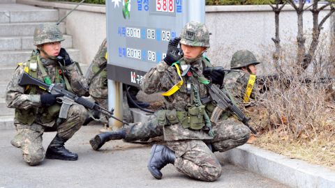 South Korean soldiers take part in a drill to guard the building of a state-run telecom company in Seoul against potential guerrilla attacks on Thursday, March 14.