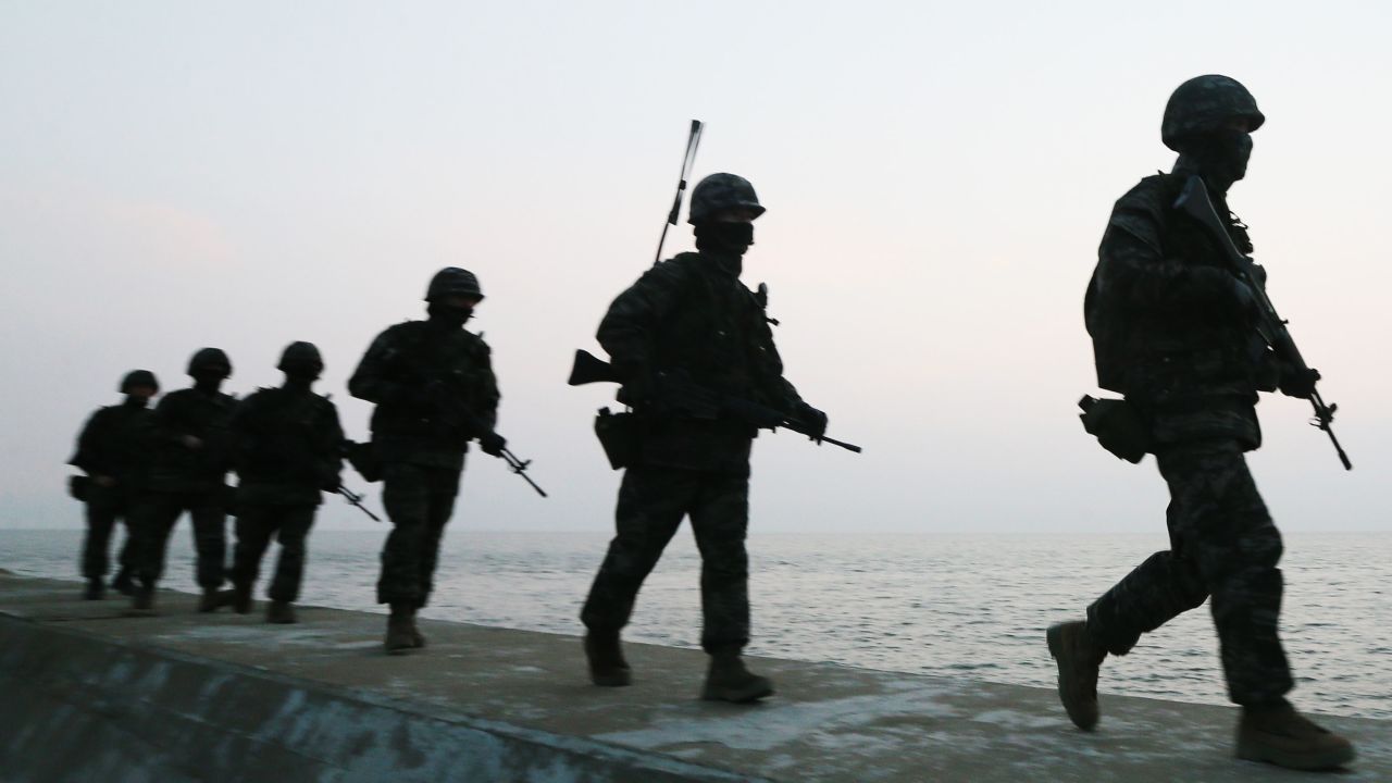 South Korean marines patrol on the South Korea-controlled island of Yeonpyeong near the disputed waters of the Yellow Sea on Tuesday, March 12.
