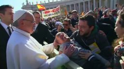 vo vatican pope francis baby disabled man_00002524.jpg