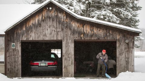 World War II veteran Sam Melnik, 90, shovels snow from his driveway on Tuesday, March 19, in Deerfield, Massachusetts.