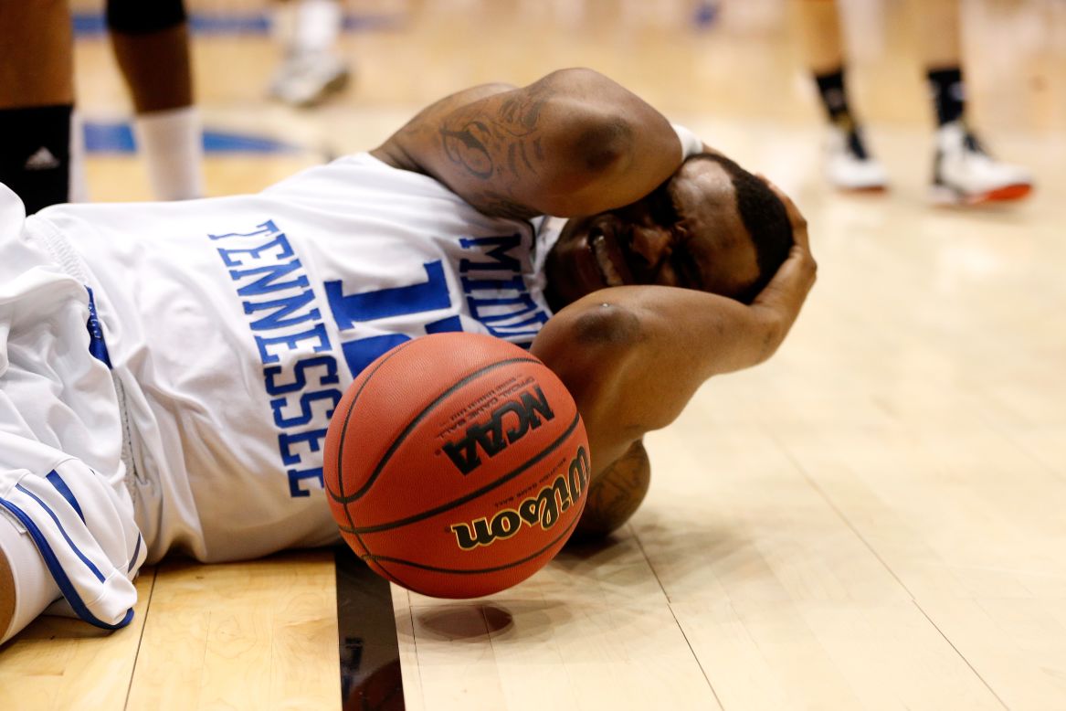 Shawn Jones of Middle Tennessee holds his head after falling hard during a play in the first half on March 19.