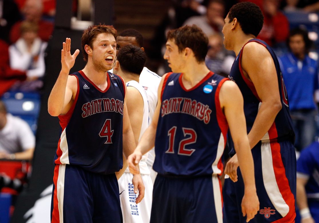 Matthew Dellavedova, left, of the St. Mary's Gaels celebrates with teammates during the First Four round of the NCAA tournament on Tuesday, March 19, in Dayton, Ohio. St. Mary's defeated Middle Tennessee 67-54 and will take on Memphis on March 21.
