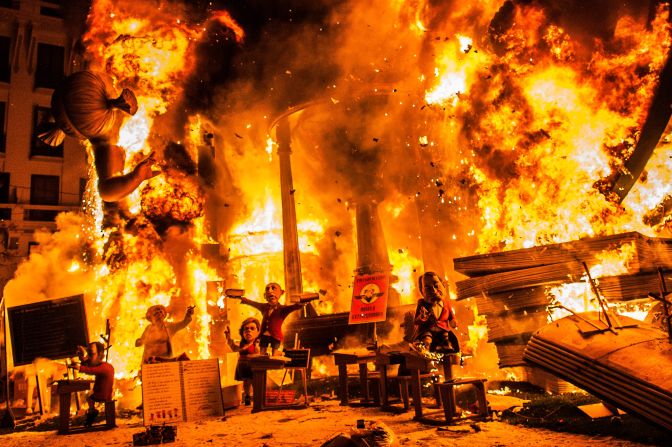 A fallas monument burns during the last day of the <a href="http://travel.cnn.com/spain-fallas-festival-727866">Las Fallas Festival</a> on Wednesday, March 20, in Valencia, Spain. Fallas are gigantic sculpted structures of cardboard and wood that satirize current events and personalities. The Spanish city's<a href="http://www.fallasfromvalencia.com/descargar-programa-en-pdf/" target="_blank" target="_blank"> four-day festival</a>, a tribute to St. Joseph, celebrates the arrival of spring with fireworks, fiestas and bonfires made from large puppets called ninots. 