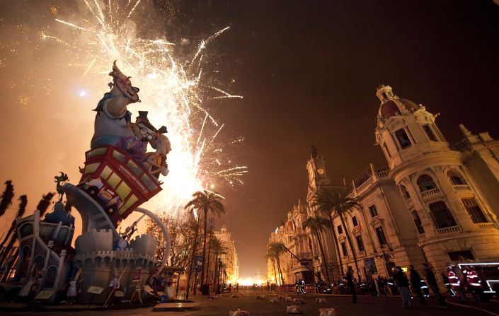 Fireworks light up the sky behind a sculpture on March 19.