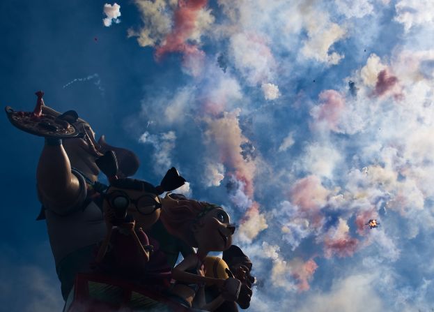 Firecrackers explode next to a falla during the mascleta, or explosion of fireworks, on March 19.